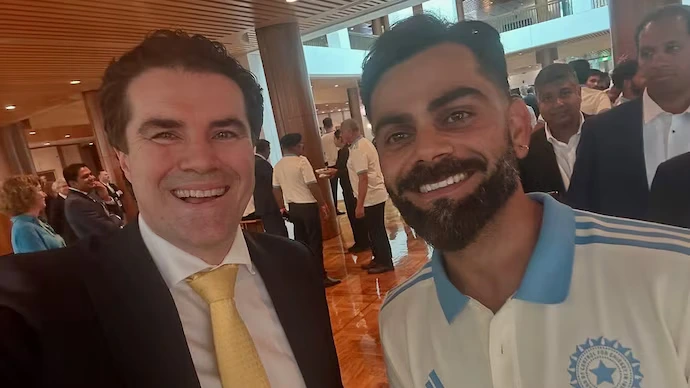 Virat Kohli and Tim Watts